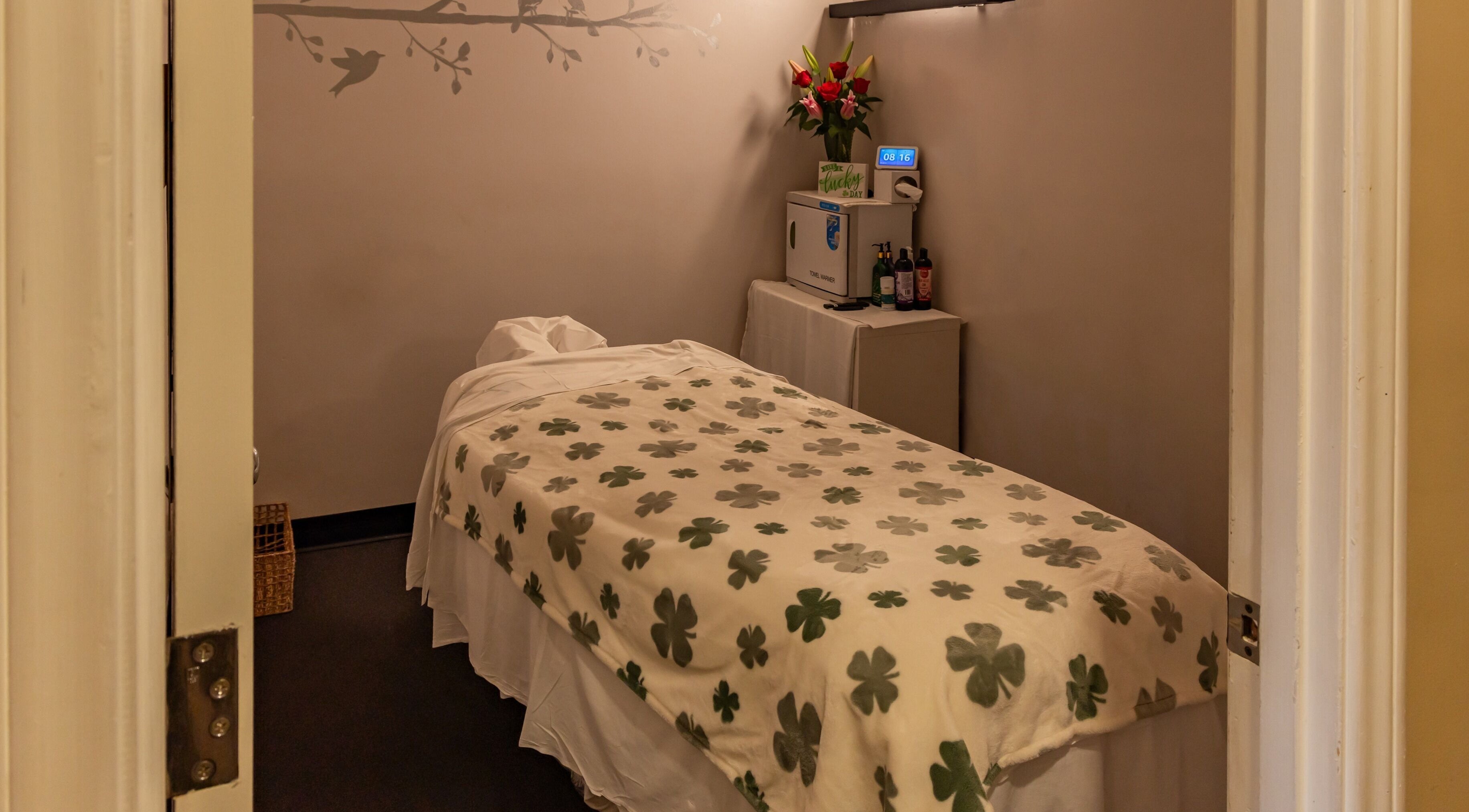 Cozy massage room at Massage One Wellness (Venice) with a flower-patterned blanket, Venice, CA, US.