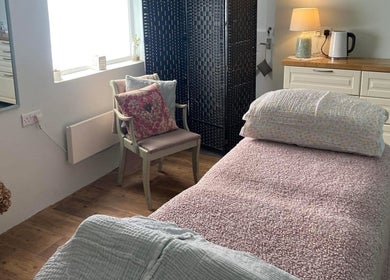 Tranquil therapy room at The Reflexology Cove - Danielle Lamb, Redruth, England, GB, featuring a cozy massage bed.