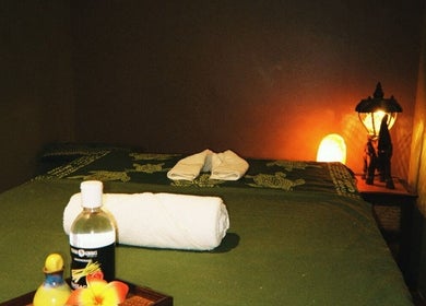 Tranquil spa room at Aromatherapy Wellness Centre, George Town, Penang, MY with massage table and warm lighting.