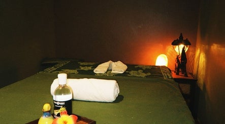 Tranquil spa room at Aromatherapy Wellness Centre, George Town, Penang, MY with massage table and warm lighting.