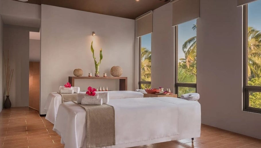 Relaxing spa room at Main Avenue Spa - Home Service, Abu Dhabi, Abu Dhabi, AE with massage tables and soothing decor.
