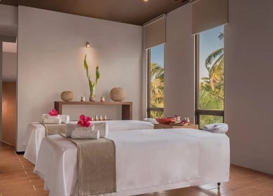 Relaxing spa room at Main Avenue Spa - Home Service, Abu Dhabi, Abu Dhabi, AE with massage tables and soothing decor.