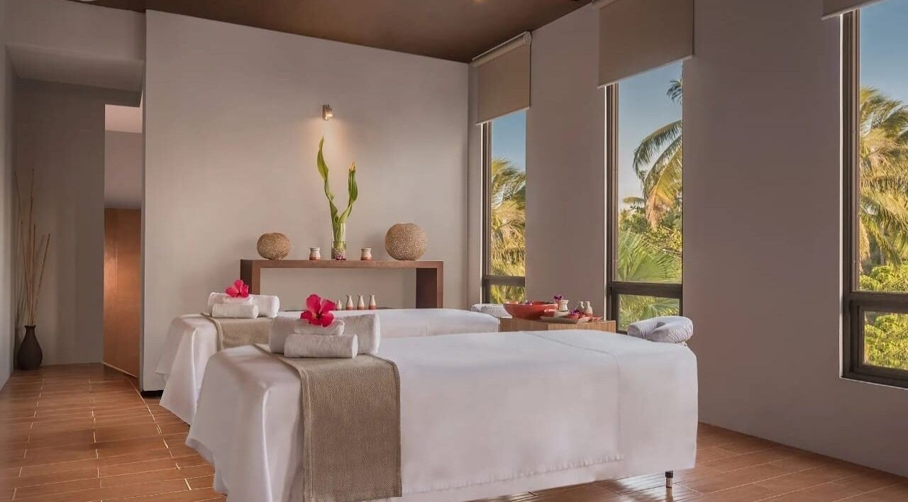 Relaxing spa room at Main Avenue Spa - Home Service, Abu Dhabi, Abu Dhabi, AE with massage tables and soothing decor.