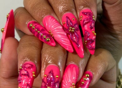 Vibrant pink floral nail art at NailsbyHashy in Malé City, Kaafu Atoll, MV.