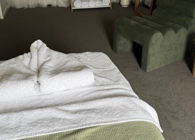 Cozy massage room at The Massage Room Braidwood, featuring fresh towels. Braidwood, New South Wales, AU.