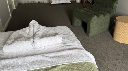 Cozy massage room at The Massage Room Braidwood, featuring fresh towels. Braidwood, New South Wales, AU.