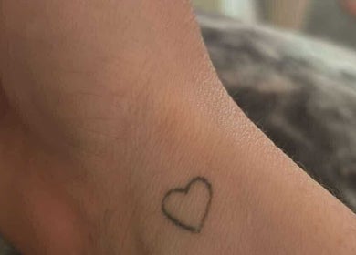 Close-up of a heart tattoo on a wrist at Lumina - Tattoo & Hair Removal, Bussum, Noord-holland, NL.