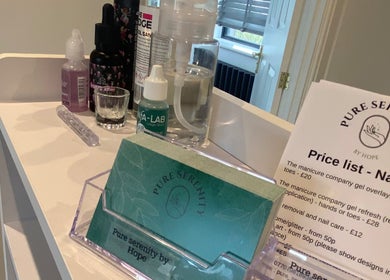 Close-up of beauty products and a price list at Pure Serenity By Hope, Norwich, England, GB.