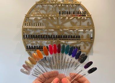 Nail polish display at Pure Serenity By Hope, Norwich, England, GB showcasing vibrant color options.