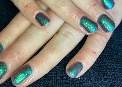 Iridescent manicure at Pure Serenity By Hope, Norwich, England, GB showcasing vibrant green shimmer.