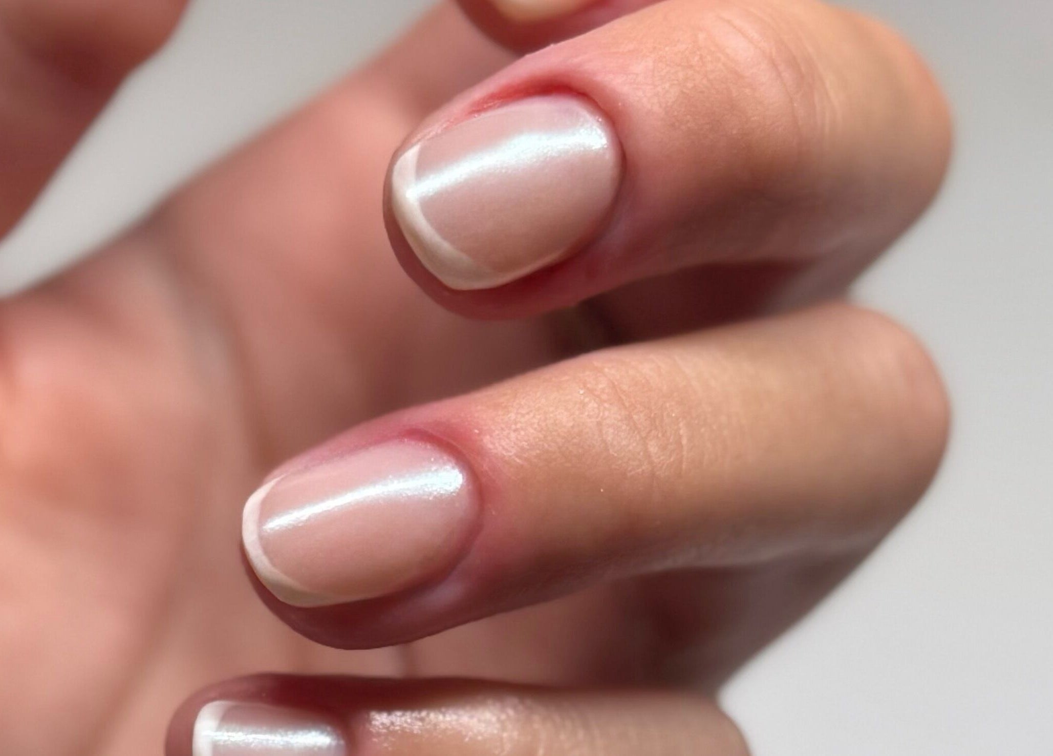Close-up of freshly manicured nails at Addy Artisan in Forres, Scotland, GB showcasing glossy finish.