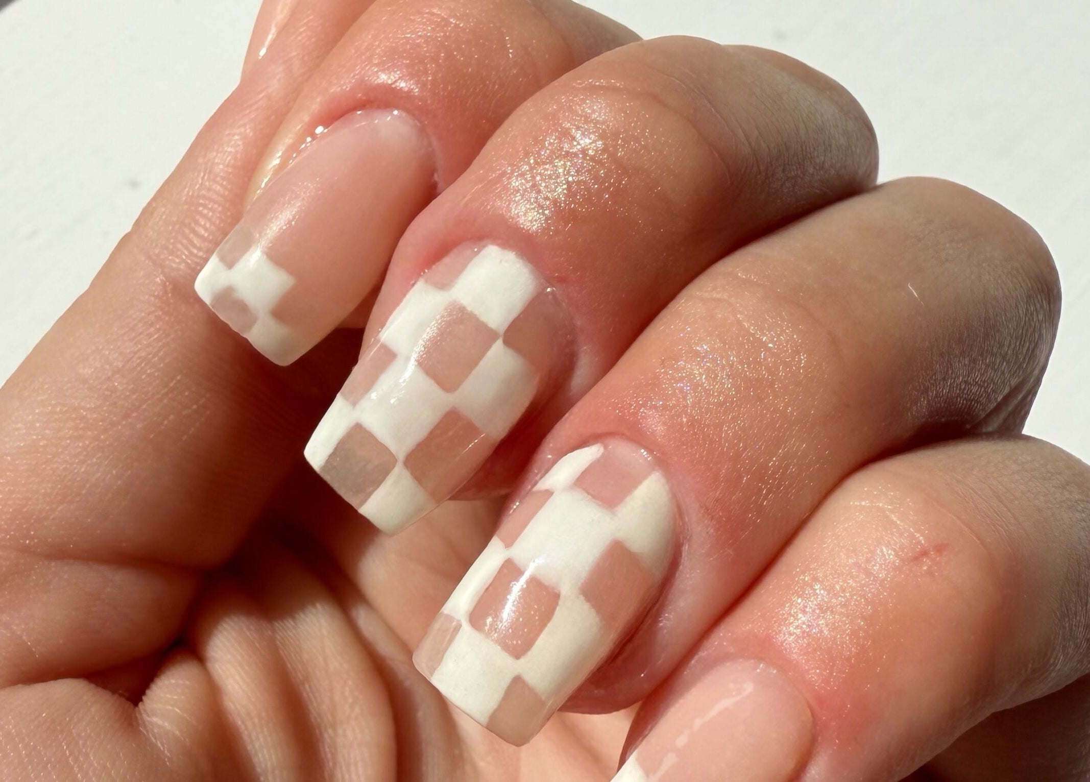 Elegant checkered nail art at Addy Artisan, Forres, Scotland, GB. Perfect for a stylish look.