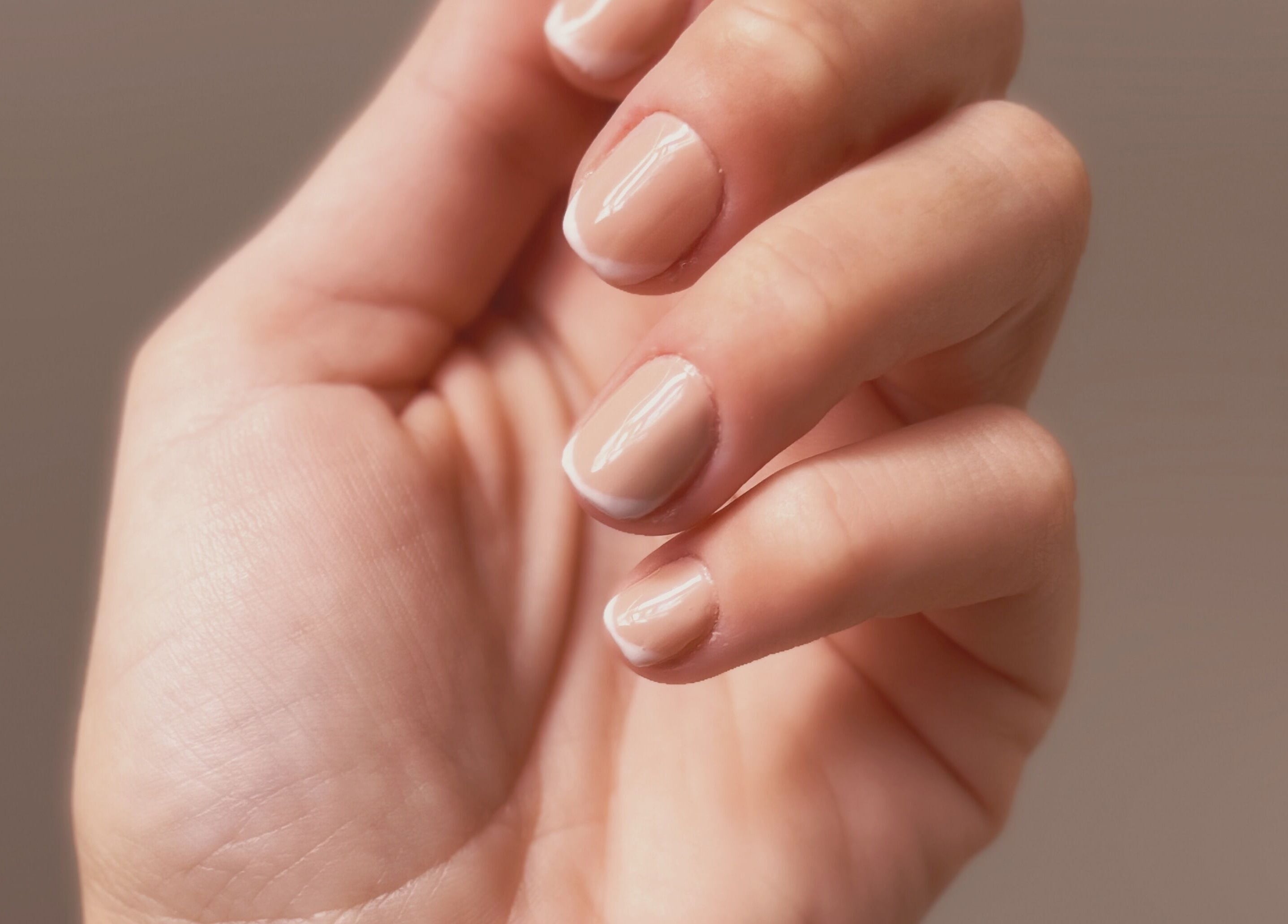 Close-up of a manicured hand at Addy Artisan, Forres, Scotland, GB highlighting elegant nail design.