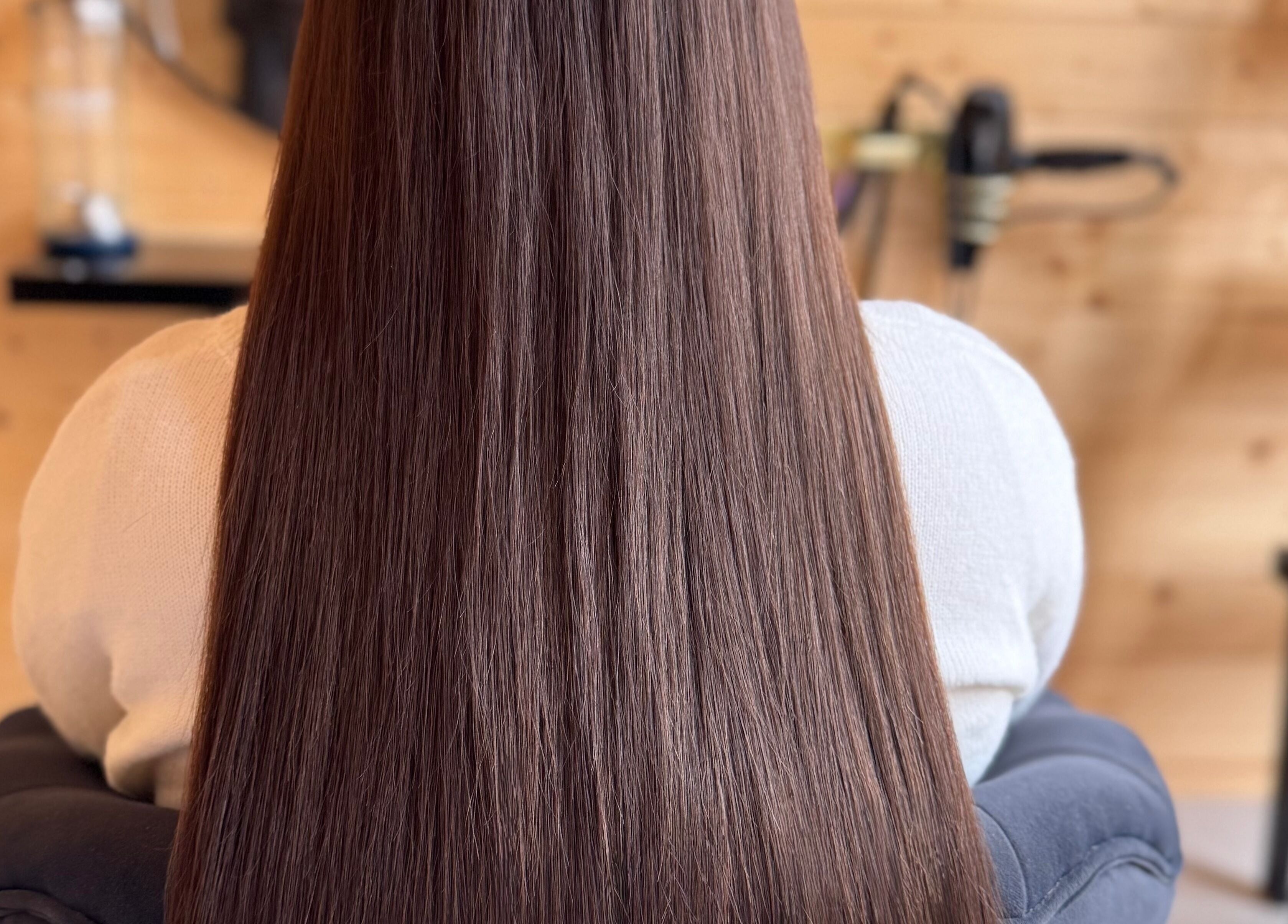 Glossy, straightened hair at KB Hair in Winchester, England, GB, showcasing expert styling and care.