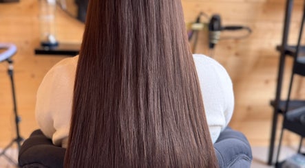 Glossy, straightened hair at KB Hair in Winchester, England, GB, showcasing expert styling and care.