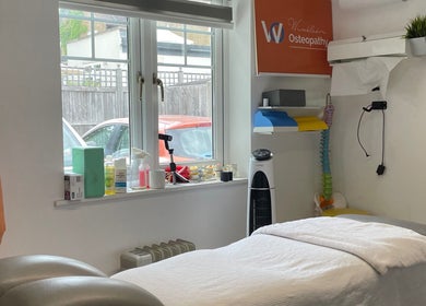 Cozy massage room at Vofitnesss - Personal Training & Sports Massage, London, England, GB, with therapeutic equipment.