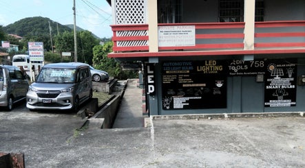 Exterior of Divine Locs & Strands, Gros Islet, showcasing LED lighting offerings.