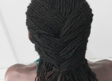 Beautiful twisted locs hairstyle at Divine Locs & Strands in Gros Islet, Gros Islet, LC, showcasing expert styling.