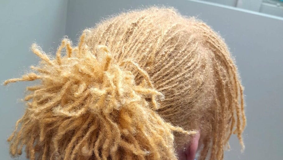 Golden locs styled elegantly at Divine Locs & Strands, Gros Islet, Gros Islet, LC.