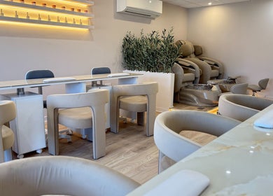 V+ Nails Brinsworth salon interior with plush seating and manicures in Brinsworth, England, GB.
