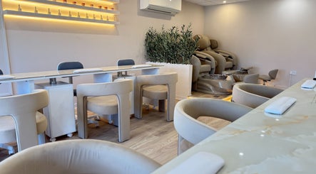 V+ Nails Brinsworth salon interior with plush seating and manicures in Brinsworth, England, GB.