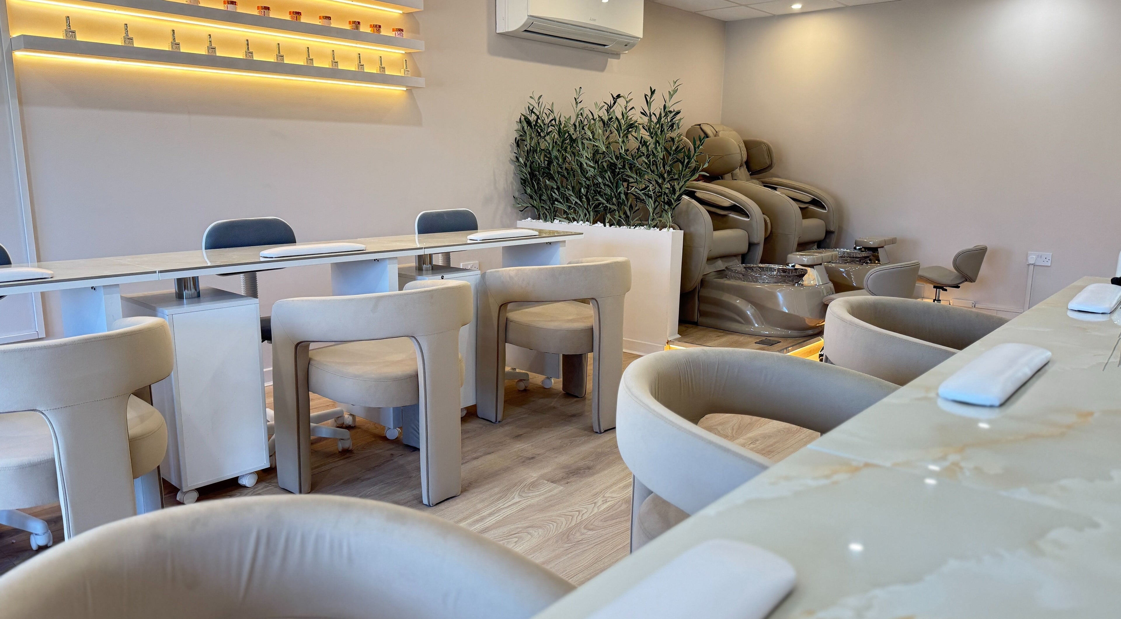V+ Nails Brinsworth salon interior with plush seating and manicures in Brinsworth, England, GB.