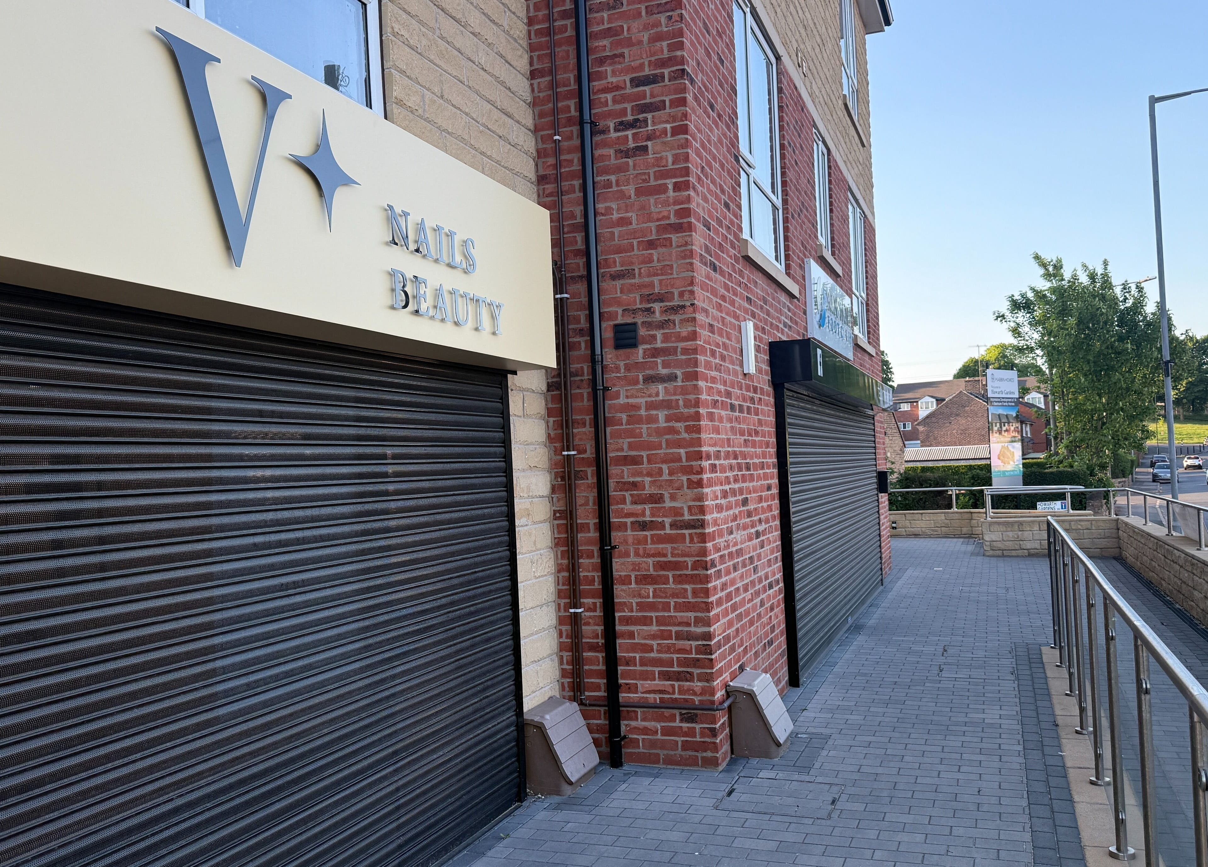Exterior of V+ Nails Brinsworth, located in Brinsworth, England, GB, showcasing brick and modern signage.