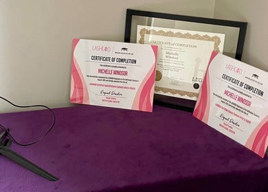 Certificates displayed at Velvet Eclipse, London, Ontario, CA, highlighting beauty skill achievements.