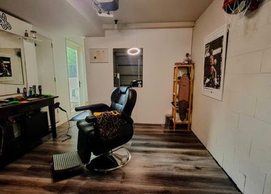 Modern barber chair at The Bro Matts Barbershop, Christchurch, Canterbury Region, NZ, showcasing sleek design.