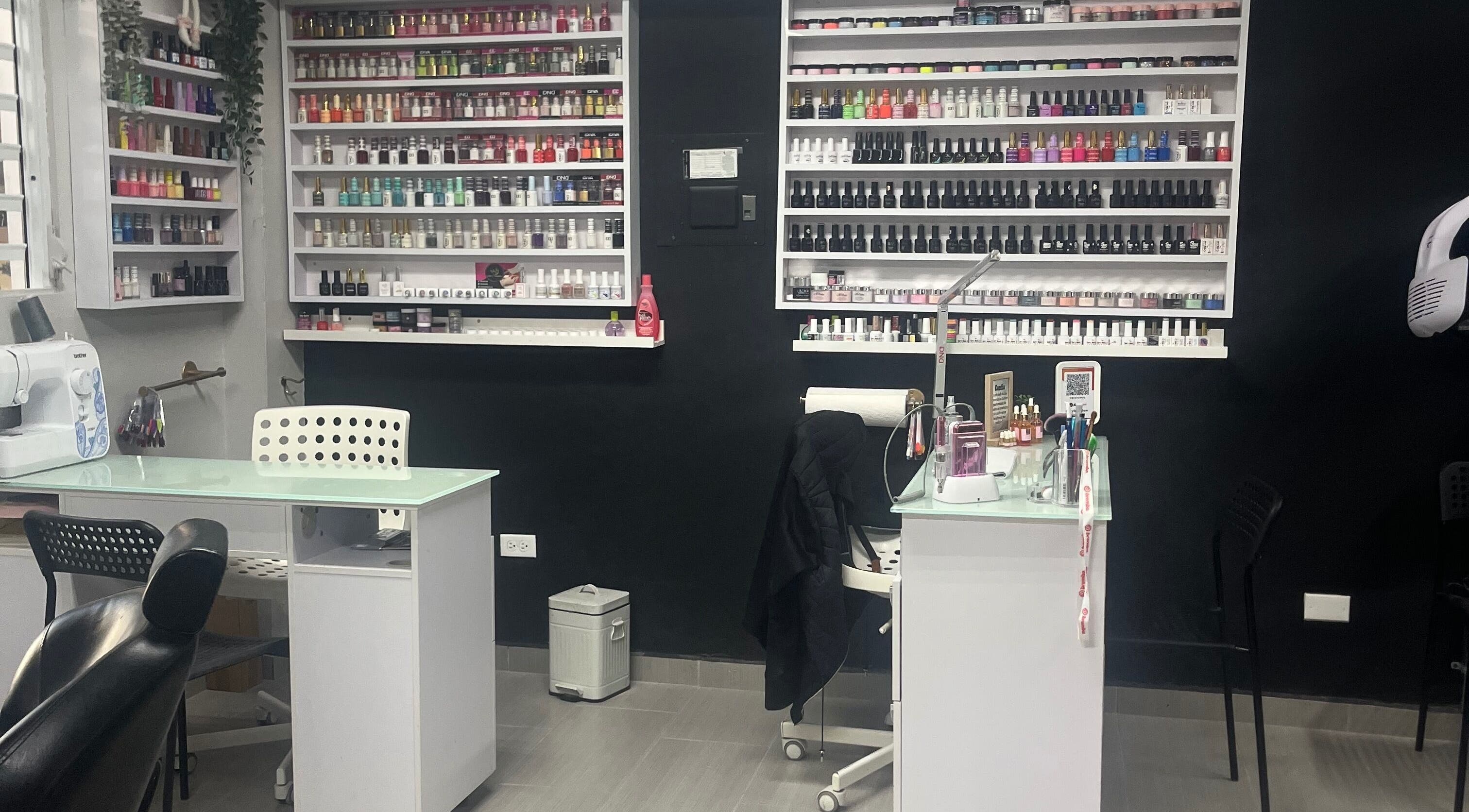 Ghel Stylist nail salon in Caguas, Caguas, PR with polish displays and modern workstations.