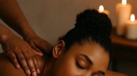 Relaxing massage at Miracle Temple in Michigan, Michigan, US with lit candles creating a calming ambiance.