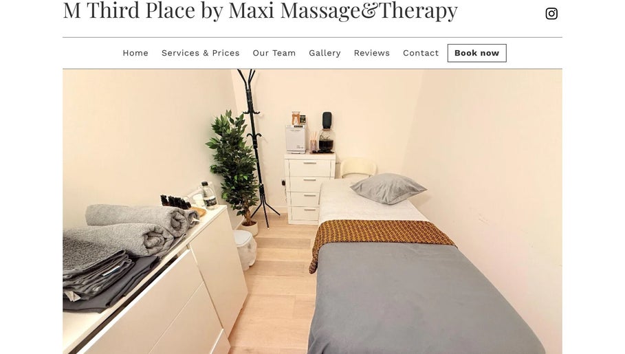 Cozy massage room at M Third Place by Maxi in London, England, GB with a bed, towels, and soothing decor.