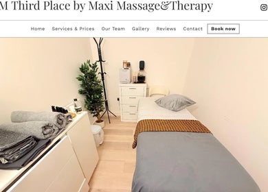 Cozy massage room at M Third Place by Maxi in London, England, GB with a bed, towels, and soothing decor.