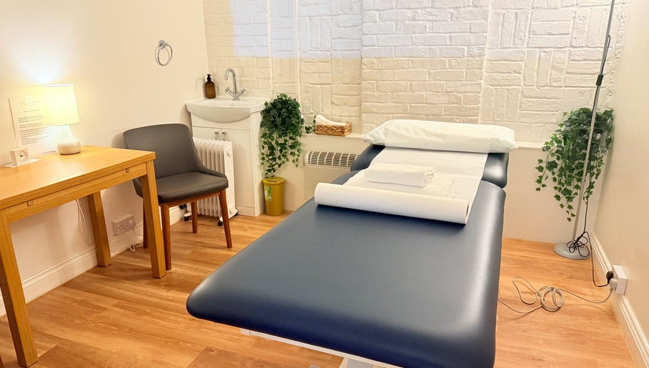 Cozy therapy room at M Third Place by Mally, featuring a massage bed in London, England, GB.