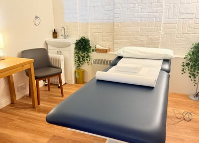 Cozy therapy room at M Third Place by Mally, featuring a massage bed in London, England, GB.