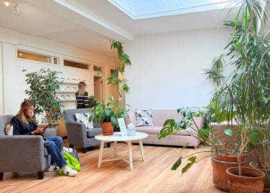 Bright seating area with plants at M Third Place by Mally in London, England, GB, offering a relaxing atmosphere.