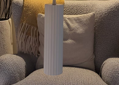 Elegant grey armchair with yellow throw at SolBeauty Studio Newstead, Newstead, Queensland, AU.