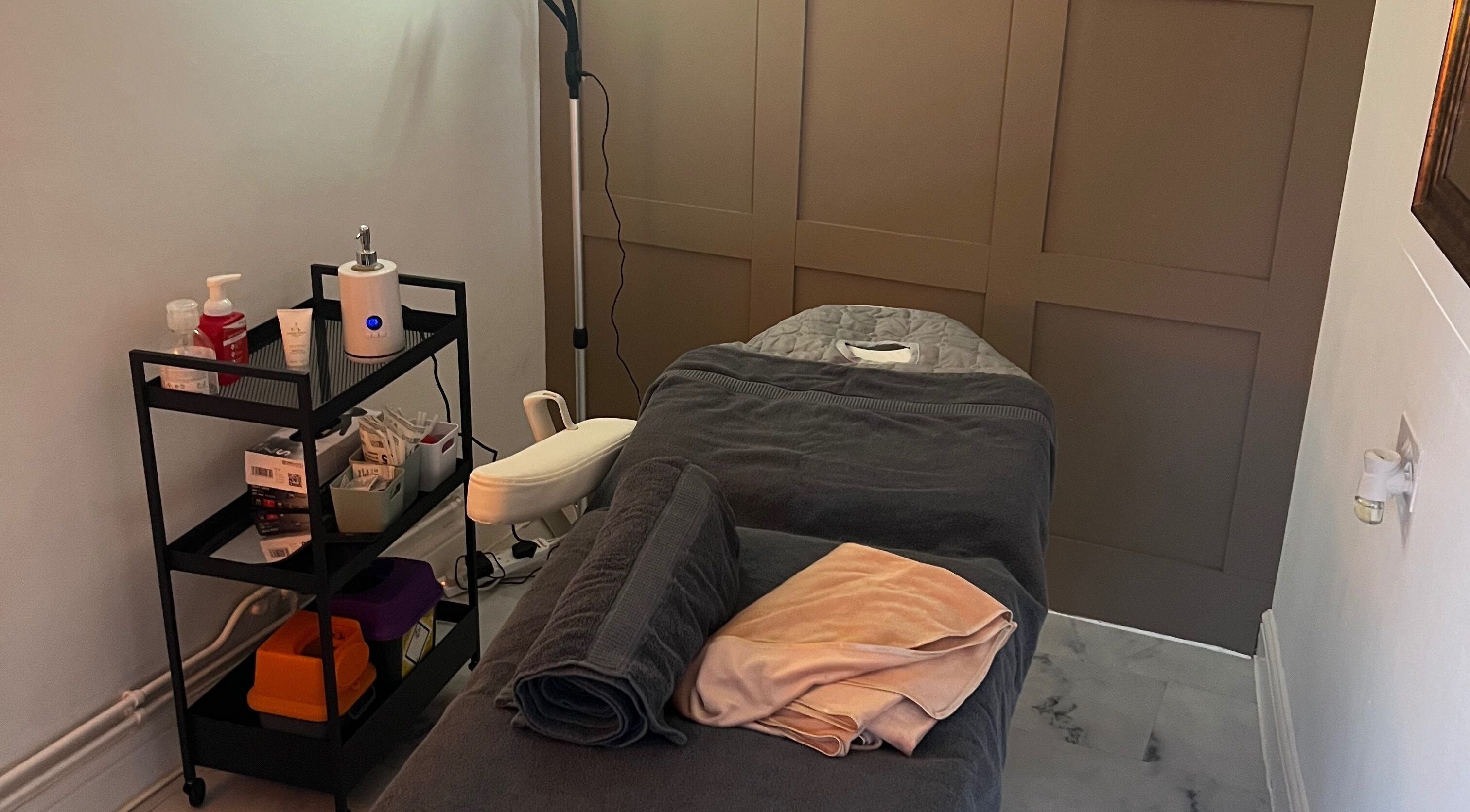 Cozy massage room with plush towels at Revive Massage, Norwich, England, GB. Perfect for relaxation and wellness.