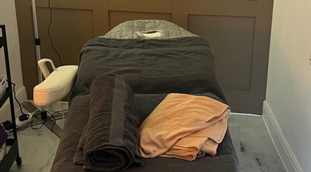 Relaxing massage table setup at Revive Massage in Norwich, England, GB, with plush towels and soothing decor.