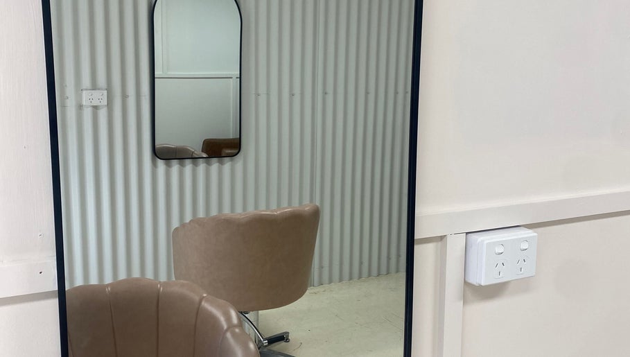 Elegant mirror and chair setup at Studio SYLK, Melbourne, Victoria, AU, showcasing modern interior design.