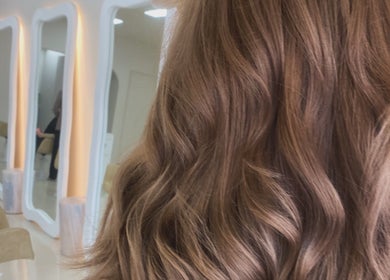 Luxurious wavy hairstyles at Studio SYLK, Melbourne, Victoria, AU. Modern salon interior with mirrors.