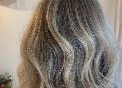 Elegant blonde waves styled at Studio SYLK in Melbourne, Victoria, AU, showcasing expert hair design.