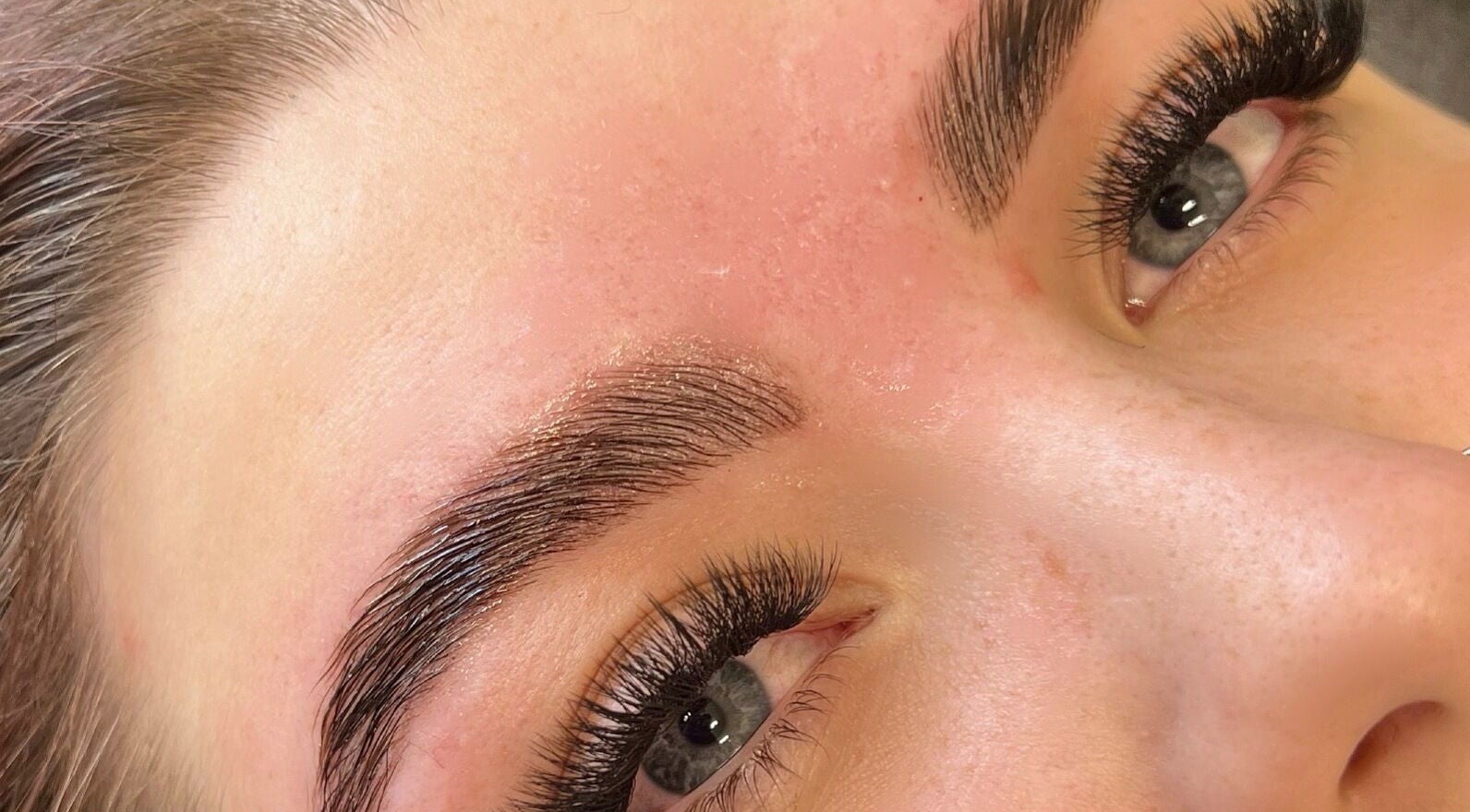 Close-up of expertly shaped eyebrows and lush lashes at beauty_withalix, Douglas, Douglas, IM.