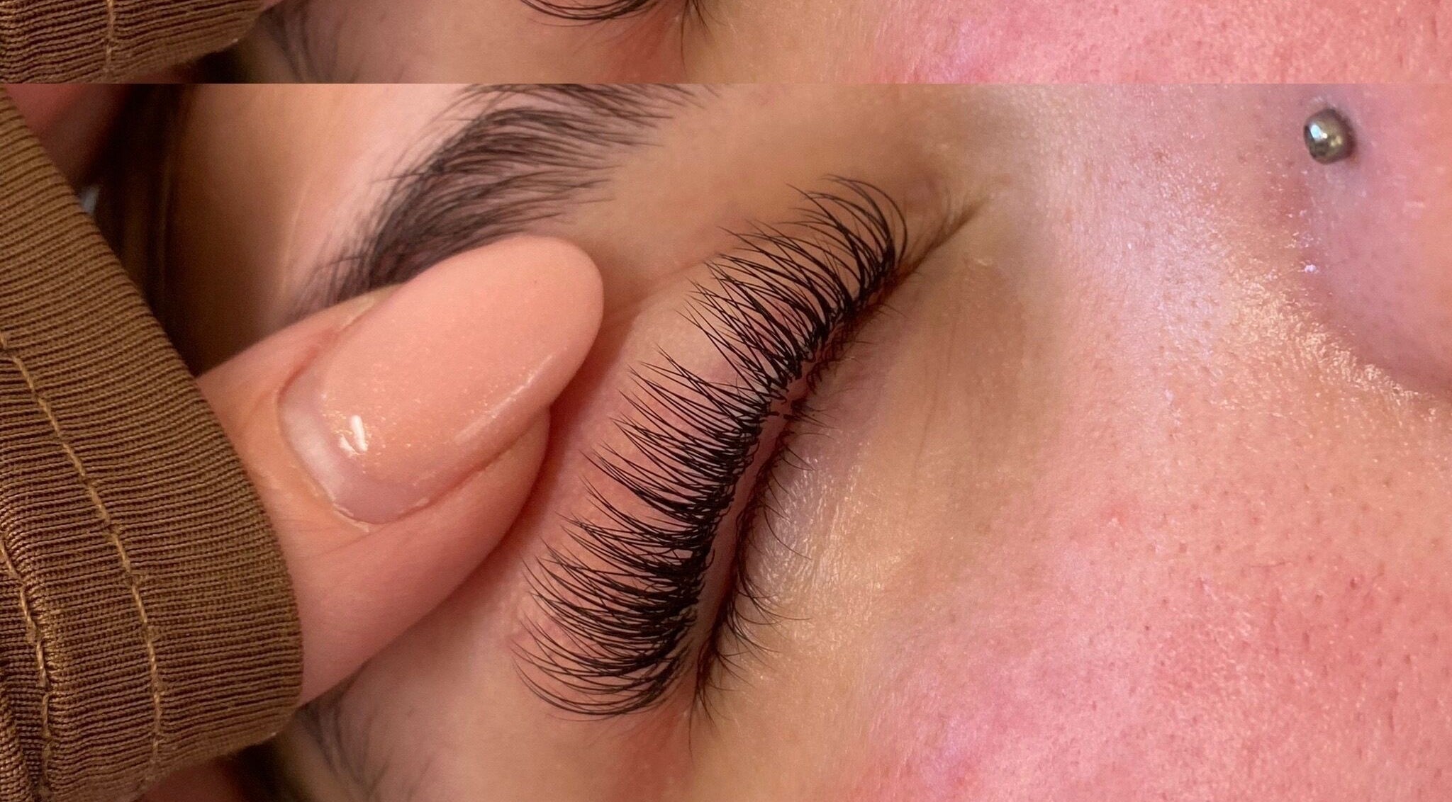 Close-up of eyelash extension service at beauty_withalix, Douglas, Douglas, IM, showcasing precision and detail.