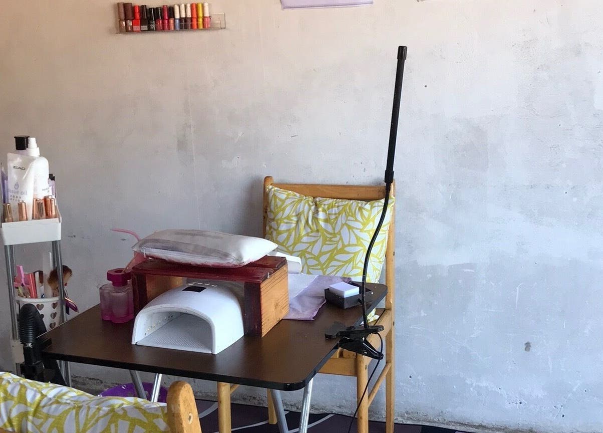 Nail station at Quickly Polished By Petro in Parys, Free State, ZA with colorful polish display.