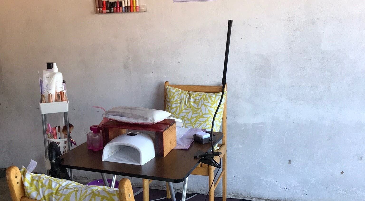 Nail station at Quickly Polished By Petro in Parys, Free State, ZA with colorful polish display.