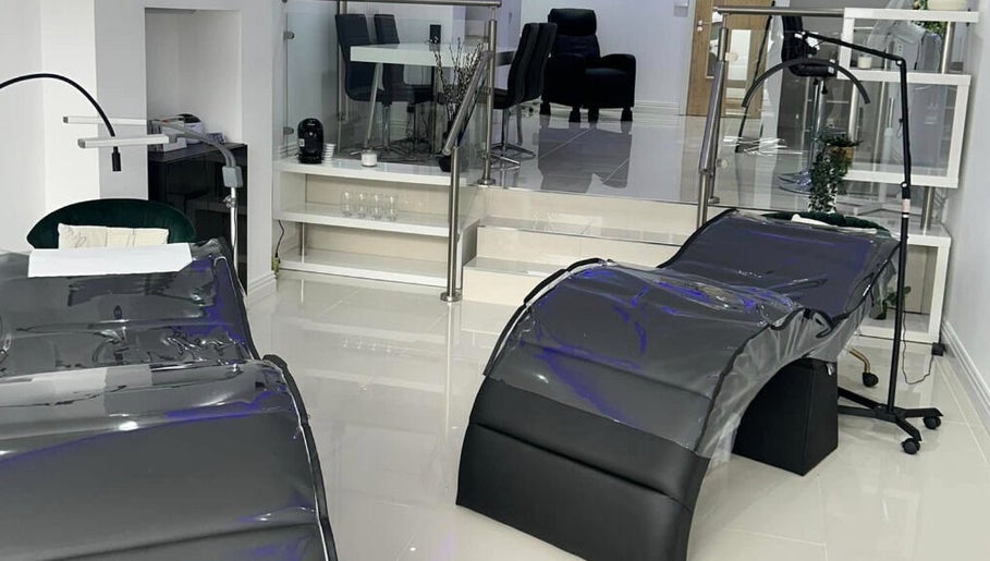 Chic modern wellness room at Lancashire Lash, Adlington, England, GB with stylish massage beds and elegant decor.