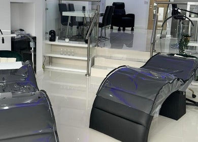 Chic modern wellness room at Lancashire Lash, Adlington, England, GB with stylish massage beds and elegant decor.