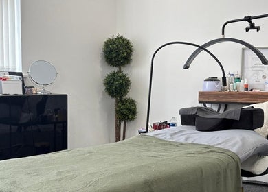 Relaxing treatment room at Lancashire Lash, Adlington, England, GB, with modern decor and beauty equipment.
