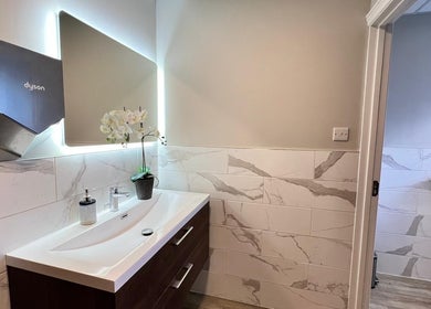 Modern restroom with sleek vanity at AURA MASSAGE AND CUPPING CLINIC, London, England, GB.
